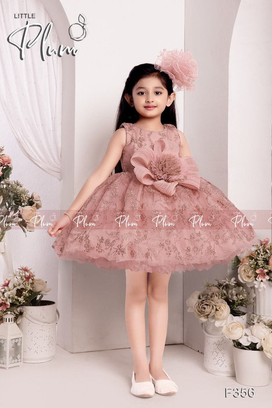Sleevless peach color dress for girls with big flower on the waist