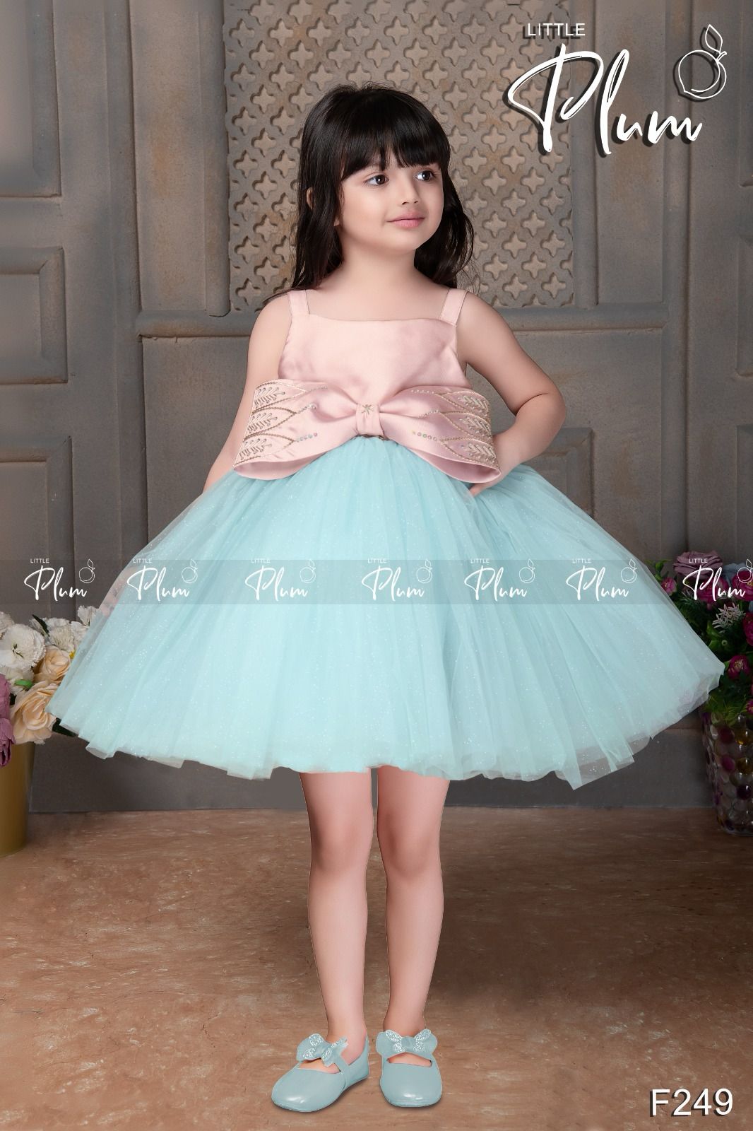 Peach color party frock with big bow