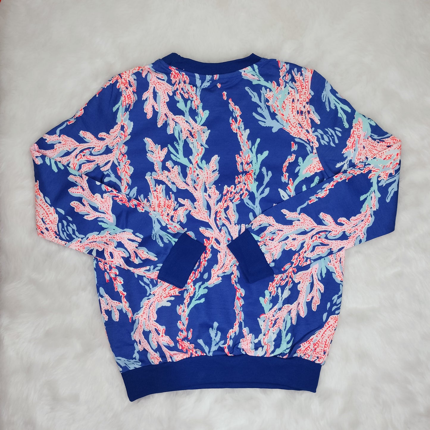 pink and orange printed blue t shirt